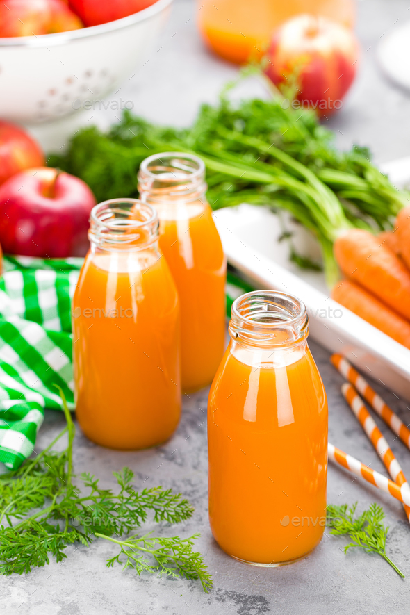 Fresh carrot and apple juice on white background. Carrot and apple juice - Stock Photo - Images