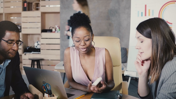 Multi Ethnic Creative Team Discussing New Project. International Business Partners Smile at alt