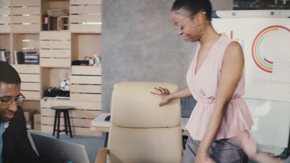 African American Female Worker Giving a Report. Happy Mixed Race Office Colleagues Develop Company alt