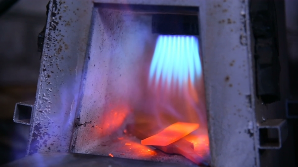 the Knife Is Heated in a Gas Oven By a Blacksmith. Forging Knife
