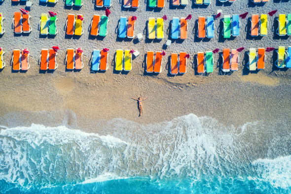 Aerial view of lying woman on the beach - Stock Photo - Images