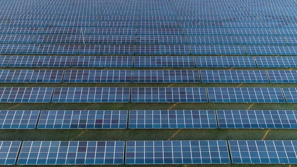 Large Field of Blue Photovoltaic Solar Panels. Aerial View. Flying ...