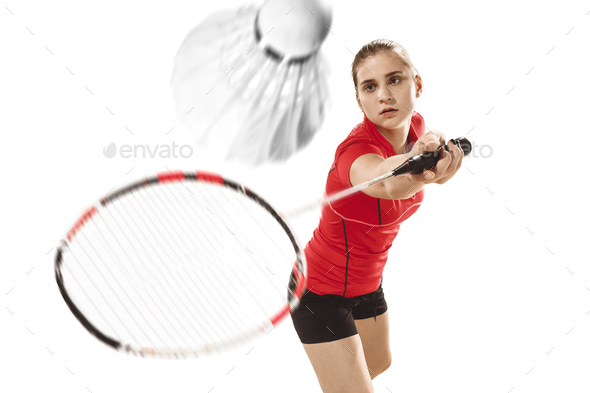 Young woman playing badminton over white background - Stock Photo - Images