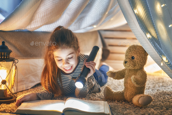 child is reading a book - Stock Photo - Images