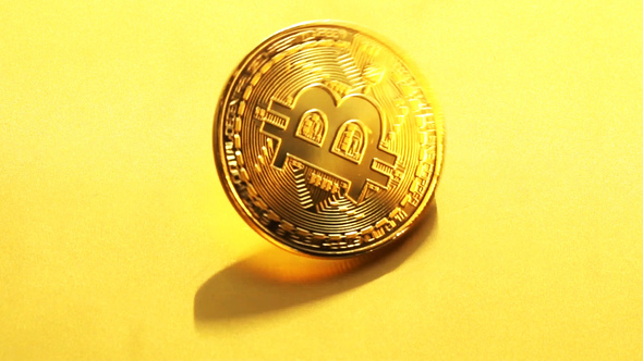 Gold coin bitcoin slowly scroll clockwise.