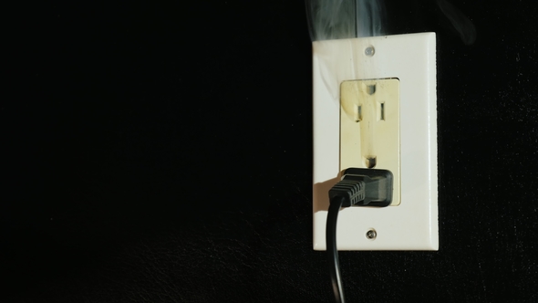 Fire in a Dual-socket US Type. Streams of Black Smoke Come From the Outlet. Danger To Life and alt
