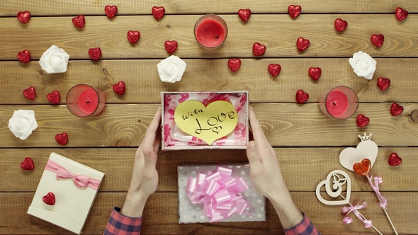 Man Gets Handmade Paper Valentine Heart As Valentine Day Present, Top View