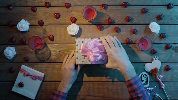 Man Gets Credit Card As Gift From Loved One, Top View