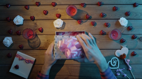 Adult Man Gets Fidget Spinner Toy As Valentine Day Present, Top View alt