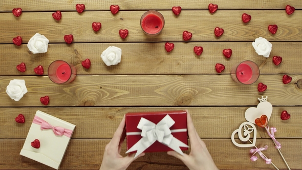 Man Gets Holiday Present in Gift Box, Top View alt