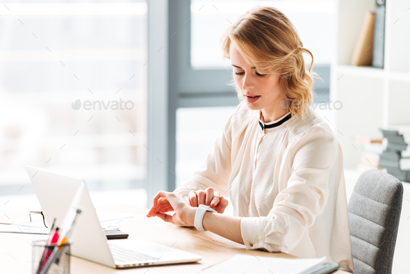 Portrait of a beautiful young businesswoman working - Stock Photo - Images