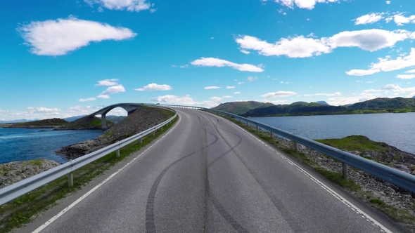 Driving a Car on a Road in Norway Atlantic Ocean Road or the Atlantic Road alt