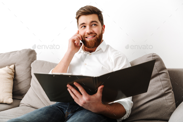 Portrait of a happy young businessman - Stock Photo - Images