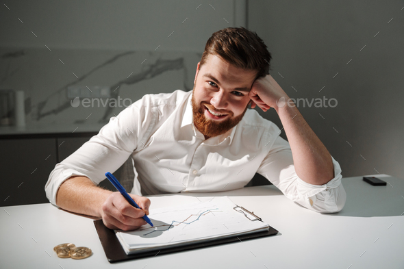 Close up portrait of a satisfied young businessman - Stock Photo - Images