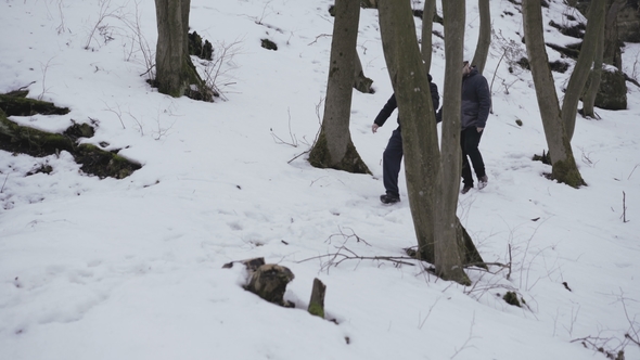 Two Speleologists Come to Enter of the Cave in Forest alt