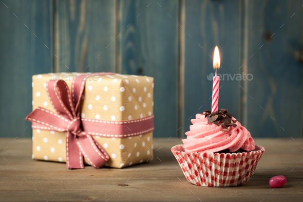 Homemade Birthday cupcake with candle and gift box Stock Photo by ff-photo