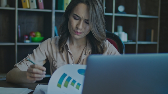 Business Market Analysis. Serious Business Woman Analyzing Finance Report alt