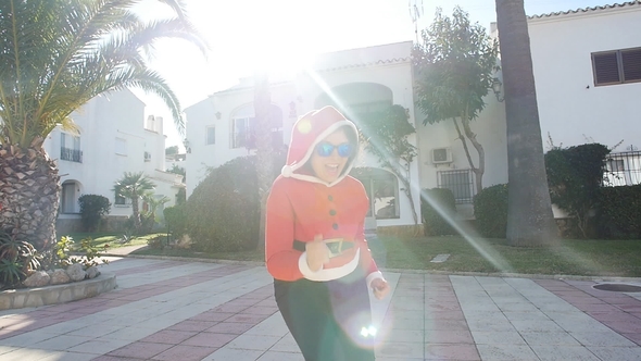 Happy Young Girl in Winter Hat near Tree Having Fun Outdoors alt