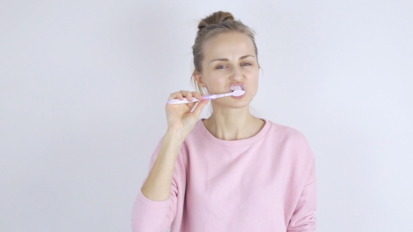 Young Woman with Toothbrush. Woman Brushing Teeth