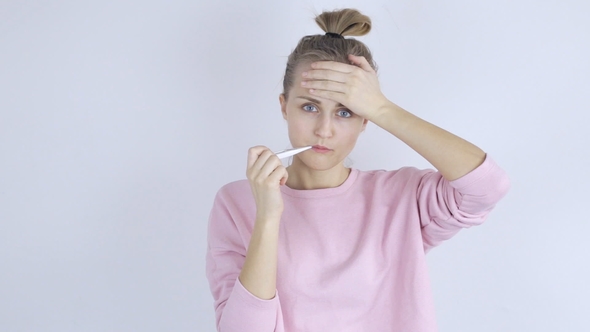 Sick Woman with Thermometer in Her Mouth