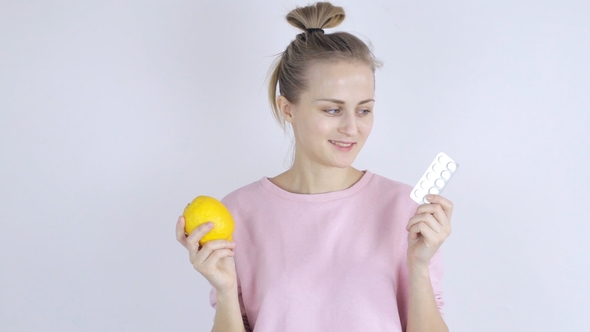Girl Chooses Between Lemon and Pills