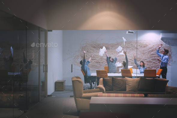 Group of young business people throwing documents - Stock Photo - Images