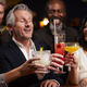 Group Of Middle Aged Friends Celebrating In Bar Together - $5.00 Group Of Middle Aged Friends Celebrating In Bar Together