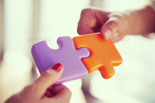business people group assembling jigsaw puzzle - Stock Photo - Images