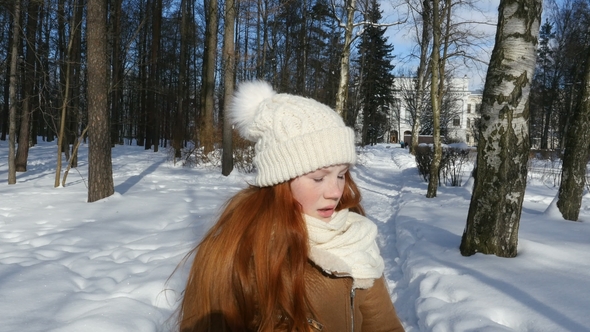 Ginger-Haired Teenage Kid Walking at Winter Sunny Day and Making Photo With Vintage Camera
