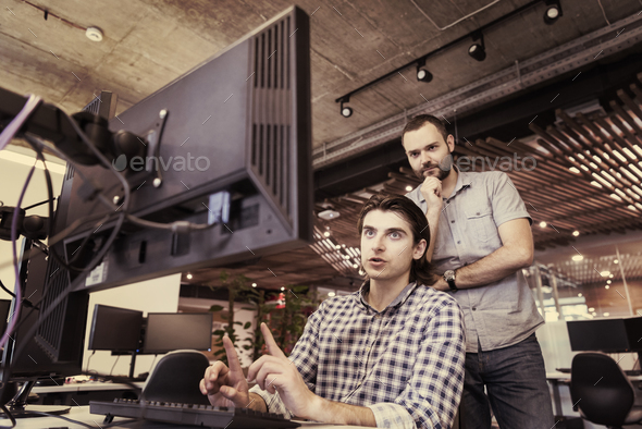 startup business people group working as team to find solution Stock Photo by dotshock