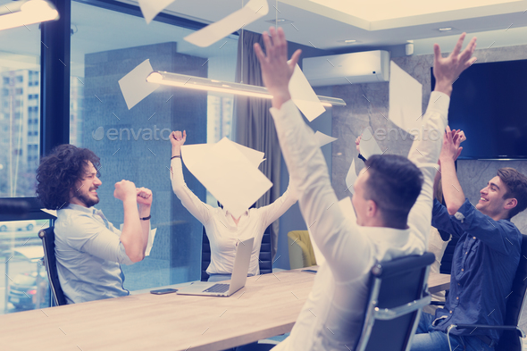 startup Group of young business people throwing documents - Stock Photo - Images