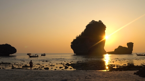 Sunset  Over the Rocks in the Sea at Thailand, Phi-phi Island, Nui Bay Lagoon.