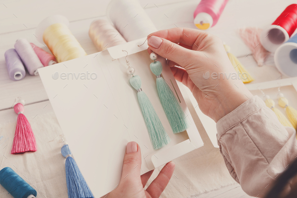 Handmade earrings packing, home workshop - Stock Photo - Images