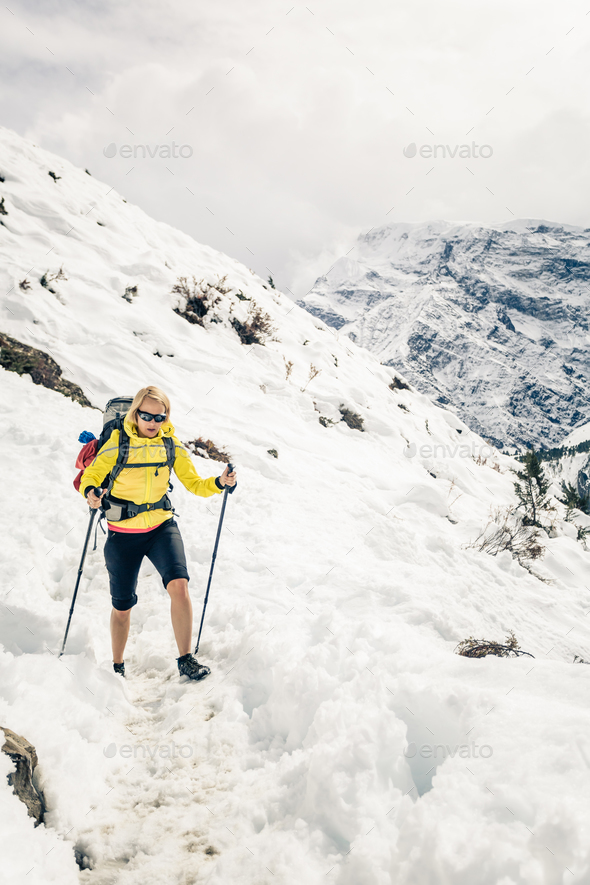 Woman hiker walking in Himalaya Mountains, Nepal - Stock Photo - Images