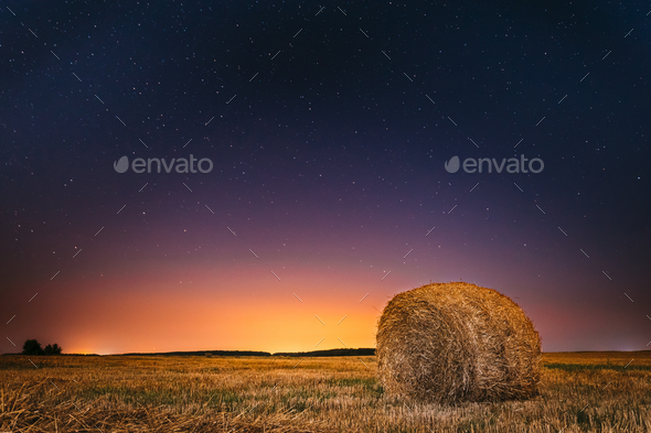 Night Starry Sky Above Field Meadow With Hay Bale After Harvest. - Stock Photo - Images