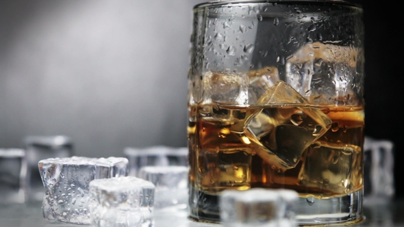 Whiskey in a Glass of Ice on a Black Background