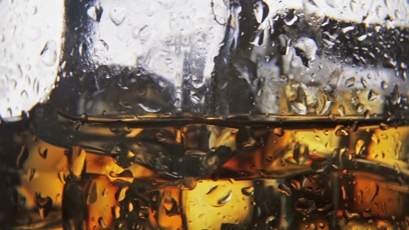 Whiskey in a Glass of Ice on a Black Background