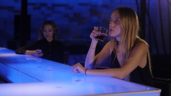 Girl Is Drinking in the Bar