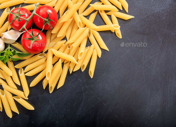 Raw penne pasta on black background Stock Photo by rawf8 | PhotoDune