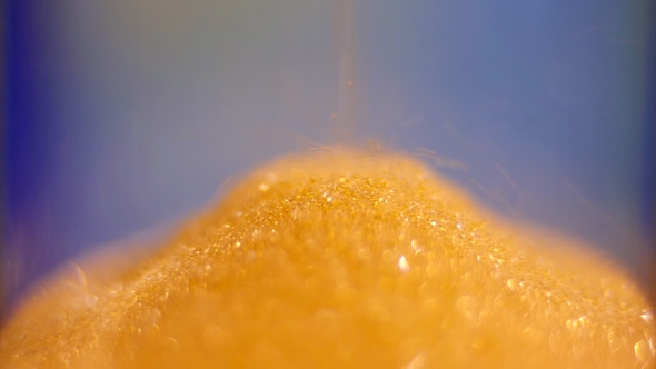 View of Sand Flowing through an Hourglass