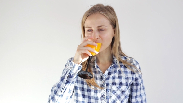 Healthy Young Girl Drinks Orange Juice