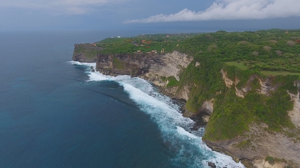 Aerial Top View of Rocks and Blue Ocean Waves in Bali alt