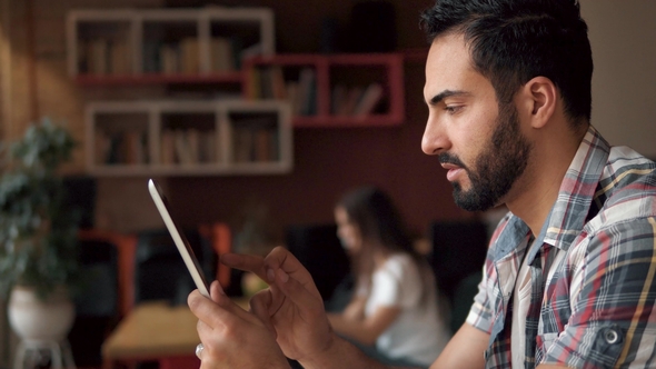 Young Man Using Tablet Young Man Using Tablet, Stock Footage | VideoHive