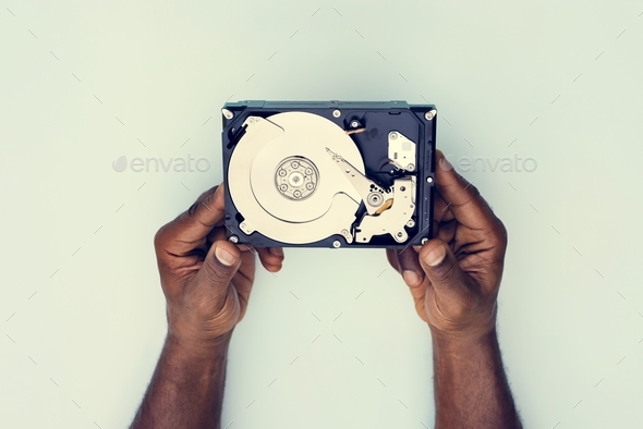 Hands holding Hard disk drive data backup isolated on background Stock Photo by Rawpixel