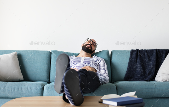 Man sleeping on the couch Stock Photo by Rawpixel | PhotoDune
