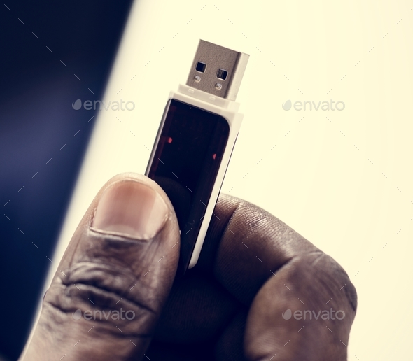 Hand holding Universal Serial Bus portable data backup Stock Photo by Rawpixel