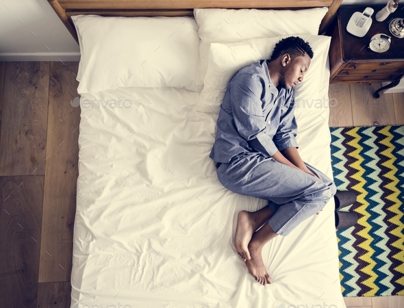 Lonely man sleeping alone on the bed Stock Photo by Rawpixel | PhotoDune