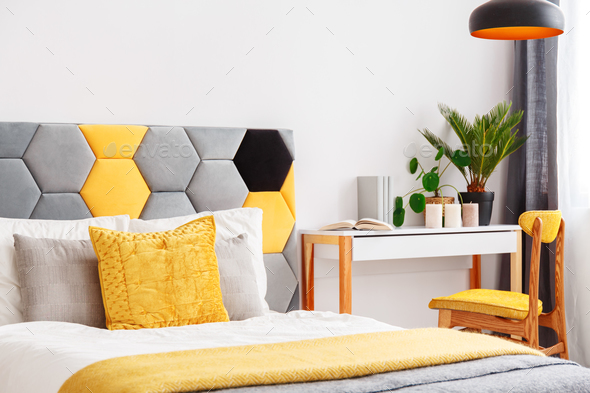 Bright bedroom with wooden desk - Stock Photo - Images