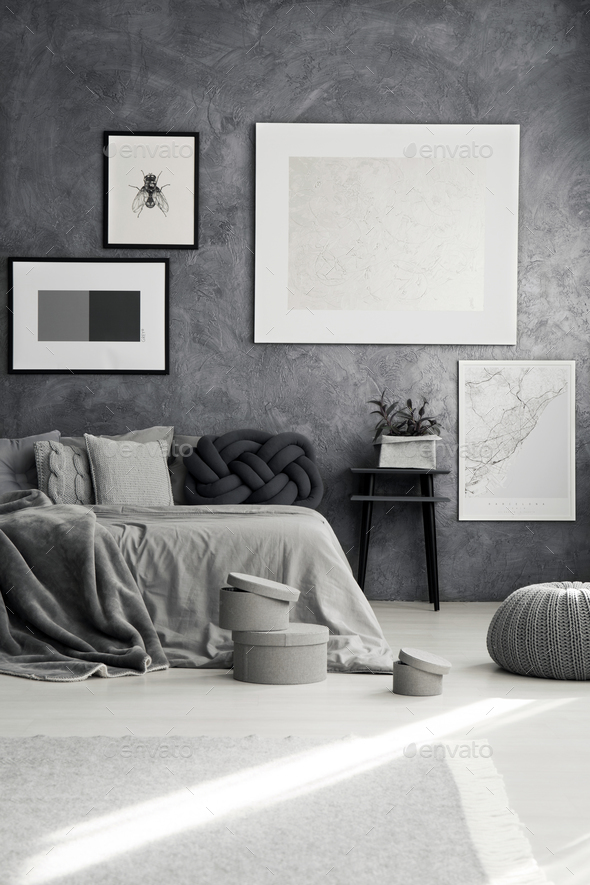 Monochromatic bedroom with gray pillows - Stock Photo - Images