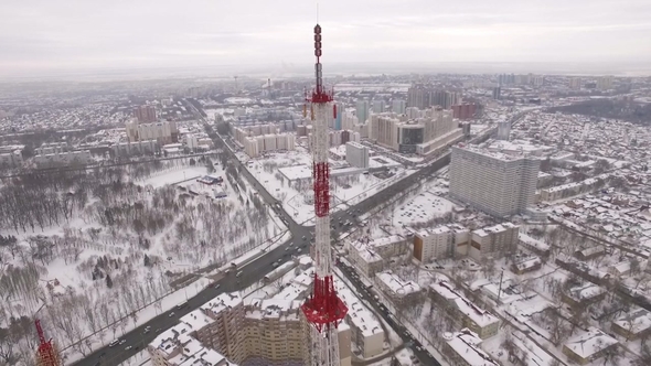 Aerial View on Top of Telecommunication Tower and Urban Landscape with Park and Crossroads